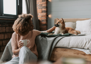 Dog shaking excitement calmed by owner at home